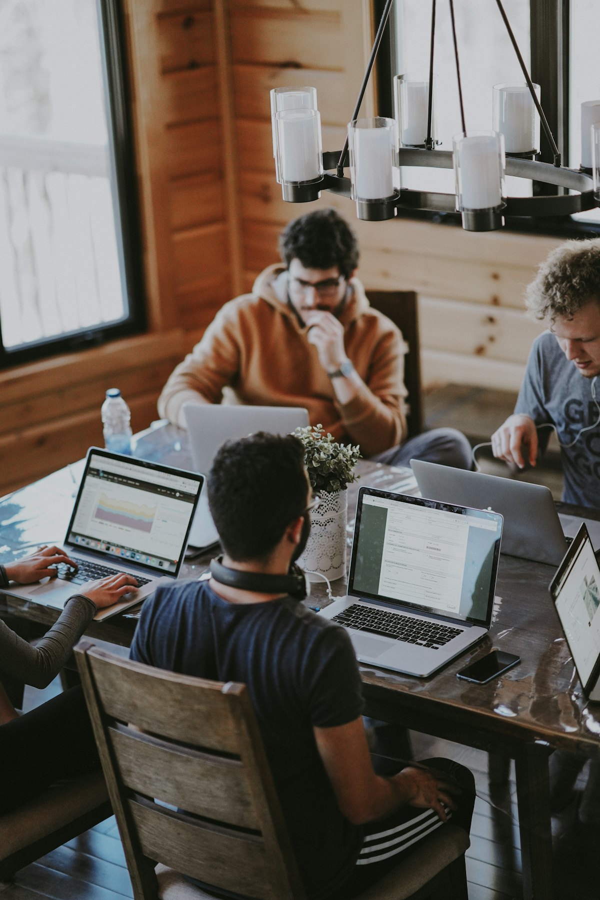 Small business team collaborating around a table in a bright office